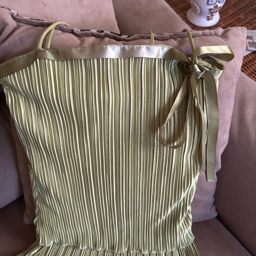 Light green top. Cute ribbon bow. Layered soft material with spaghetti straps.
